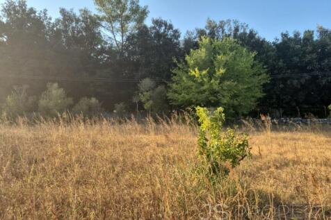 Land with small house 