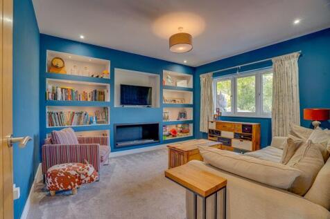 Living room with ambient lighting and...