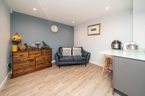 KITCHEN WITH SITTING/TV AREA