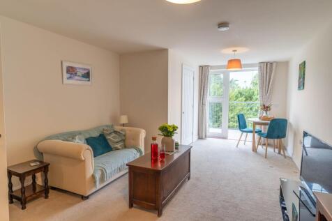 Living/dining room with access to balcony