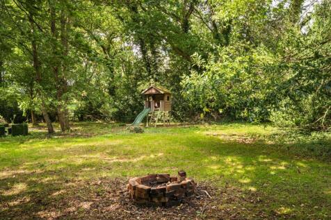 Wooded glade at the rear