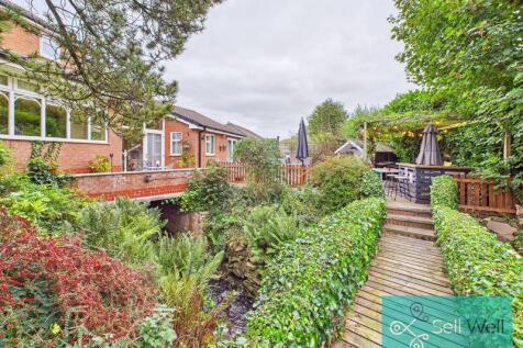 Picturesque Garden with Footbridge