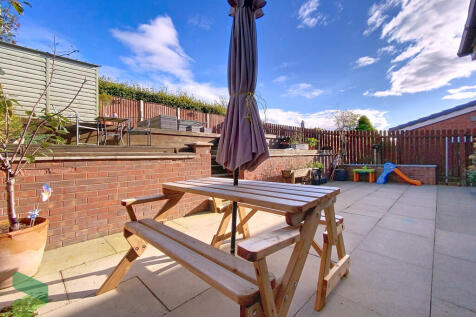 Rear patio and ga...