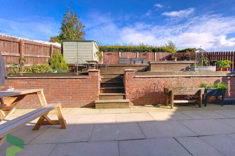 Rear patio and ga...