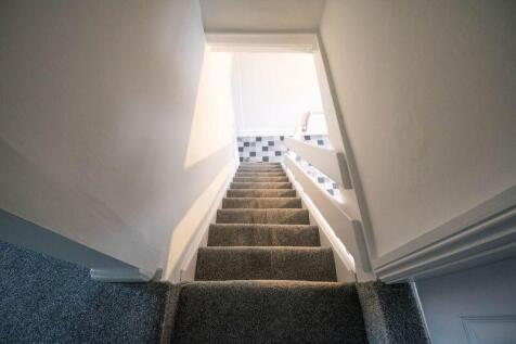 Stairwell to the Upper Floor.