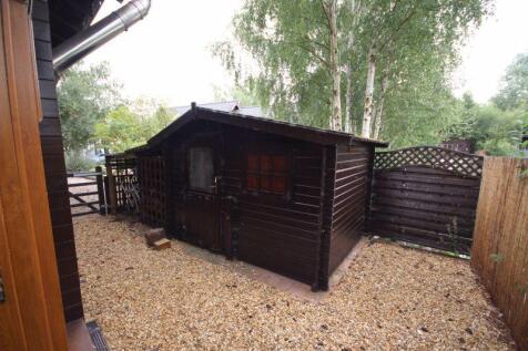 Side garden with shed and storage