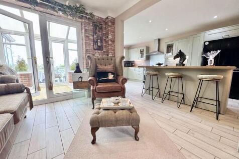 Open into kitchen