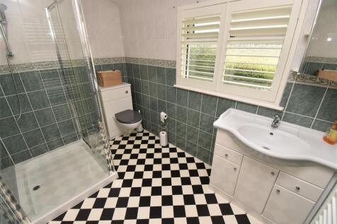BEDROOM ONE EN-SUITE SHOWER ROOM
