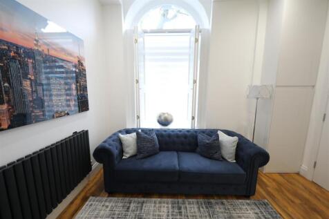 Apt 16 Academy - Sofa and window.jpeg
