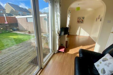 sitting room through to bedroom open plan.jpg