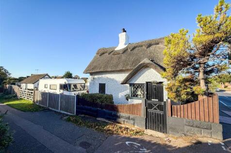SIDE VIEW OF COTTAGE