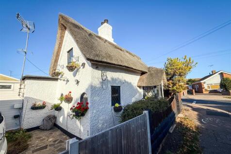 SIDE VIEW OF COTTAGE