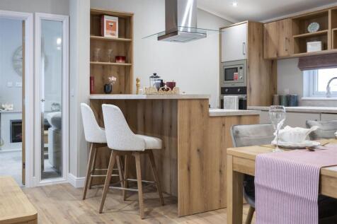 ALTERNATE VIEWS OF KITCHEN & LIVING AREA