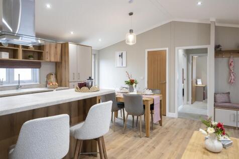 ALTERNATE VIEWS OF KITCHEN & LIVING AREA