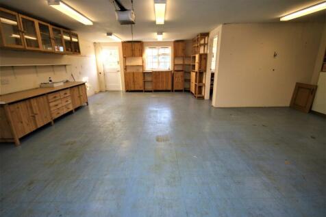 INTERIOR OF TRIPLE GARAGE WITH OWN DRIVE: PIC. 1
