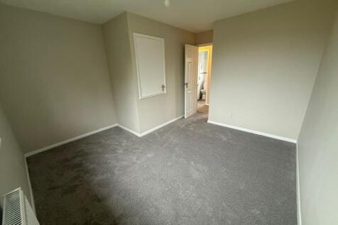carpeted bedroom 1