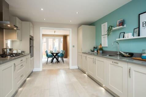 The kitchen leads to the family-friendly dining room