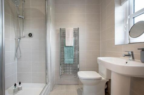 En-suite shower room away from the family