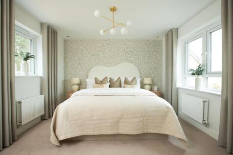 The king-size main bedroom has ample storage space