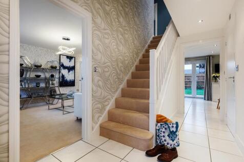 The central entrance hallway and convenient cloakroom