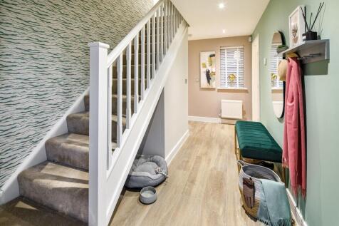 The entrance hall leads to the downstairs living space