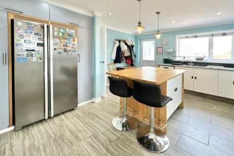 Kitchen Towards Back Door &amp; Living Room.JPG