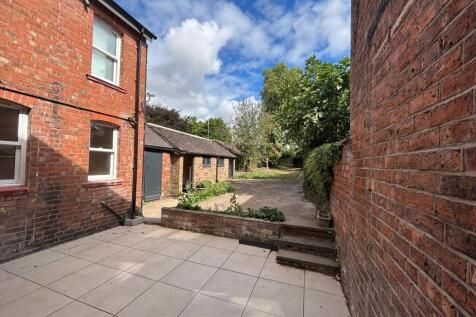 Outdoor garden and patio area.
