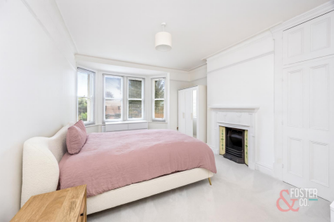 Serene Bedroom with Bay Window.png