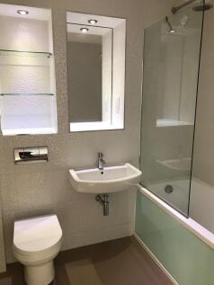 Bathroom with over the bath shower 