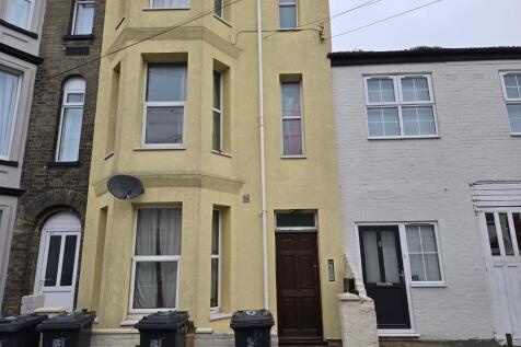 Front of building - flat is top window