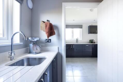 The utility room offers extra storage space