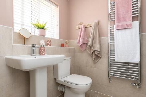 The second bedroom also features an en suite shower room