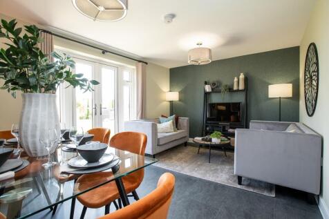 A bright and airy living room with French doors to the garden