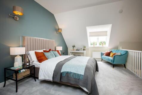 The top floor is dedicated to the master bedroom and en suite shower room