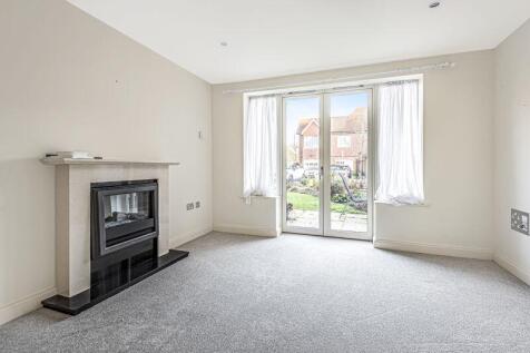 Living/dining room with fireplace and...