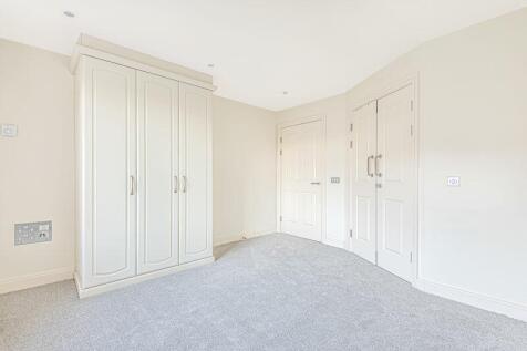Bedroom with fitted wardrobes and ens...