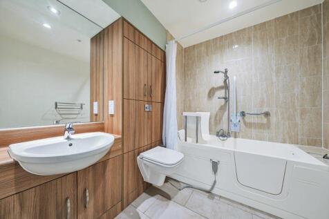 Bathroom with over-bath shower