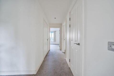 Hallway with storage cupboard