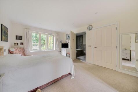 Bedroom with fitted wardrobes and ens...