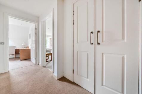 Hallway with storage cupboard
