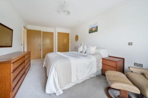 Bedroom with fitted wardrobes and ens...