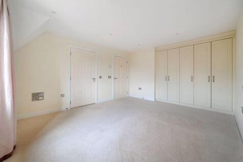 Bedroom with fitted wardrobes and ens...
