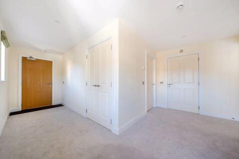 Hallway with storage cupboards