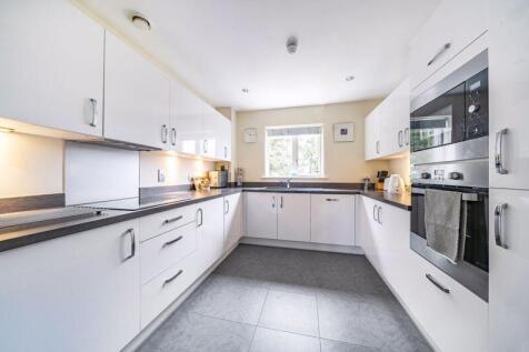Kitchen with built-in appliances