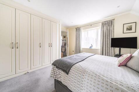 Master bedroom with fitted wardrobe a...