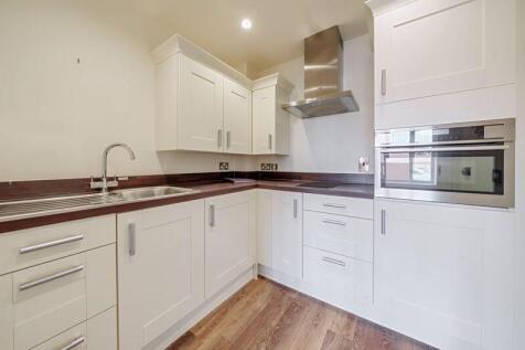 Kitchen with built-in appliances