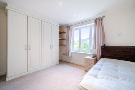 Bedroom with fitted wardrobes and ens...
