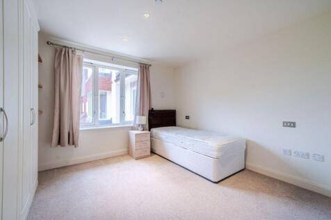 Bedroom with fitted wardrobes and ens...