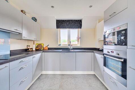 Kitchen with built-in appliances