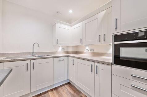 Kitchen with built-in appliances